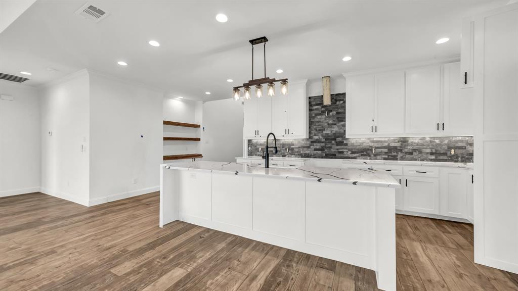 3451 Carraway Tbd County Road Paradise, TX 76073 - Photo 8 of 24 a kitchen with kitchen island granite countertop a sink cabinets and wooden floor