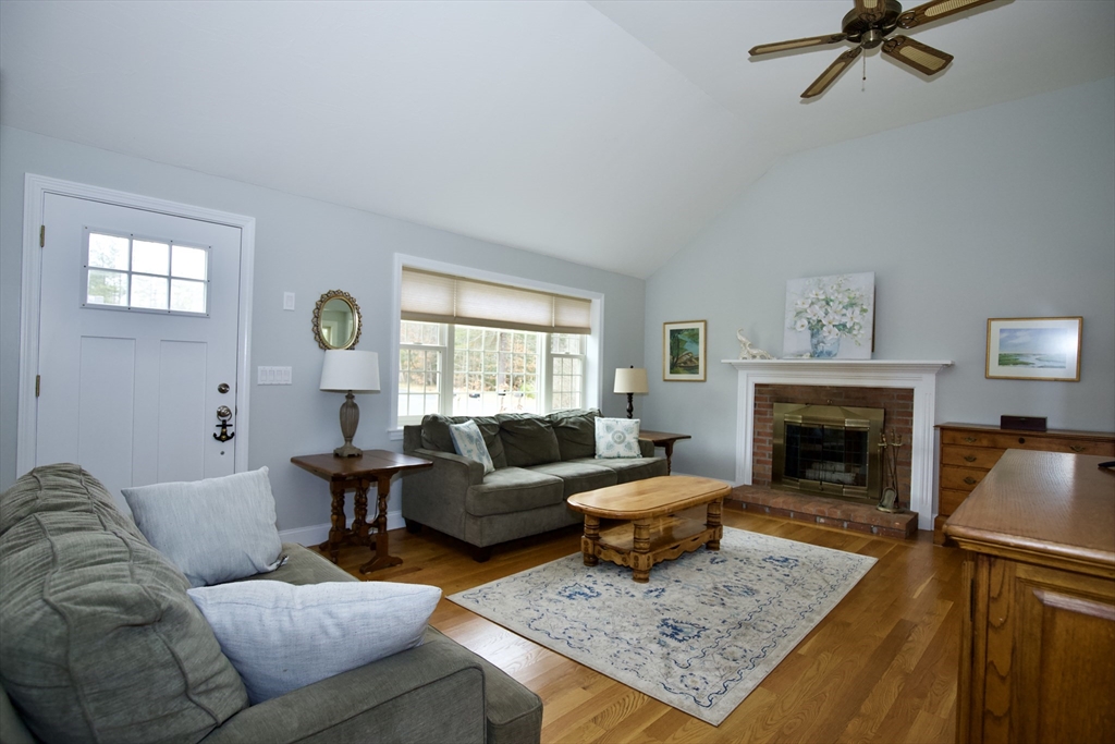100 Black Oak Road Barnstable, MA 02648 - Photo 3 of 14 a living room with furniture and a fireplace