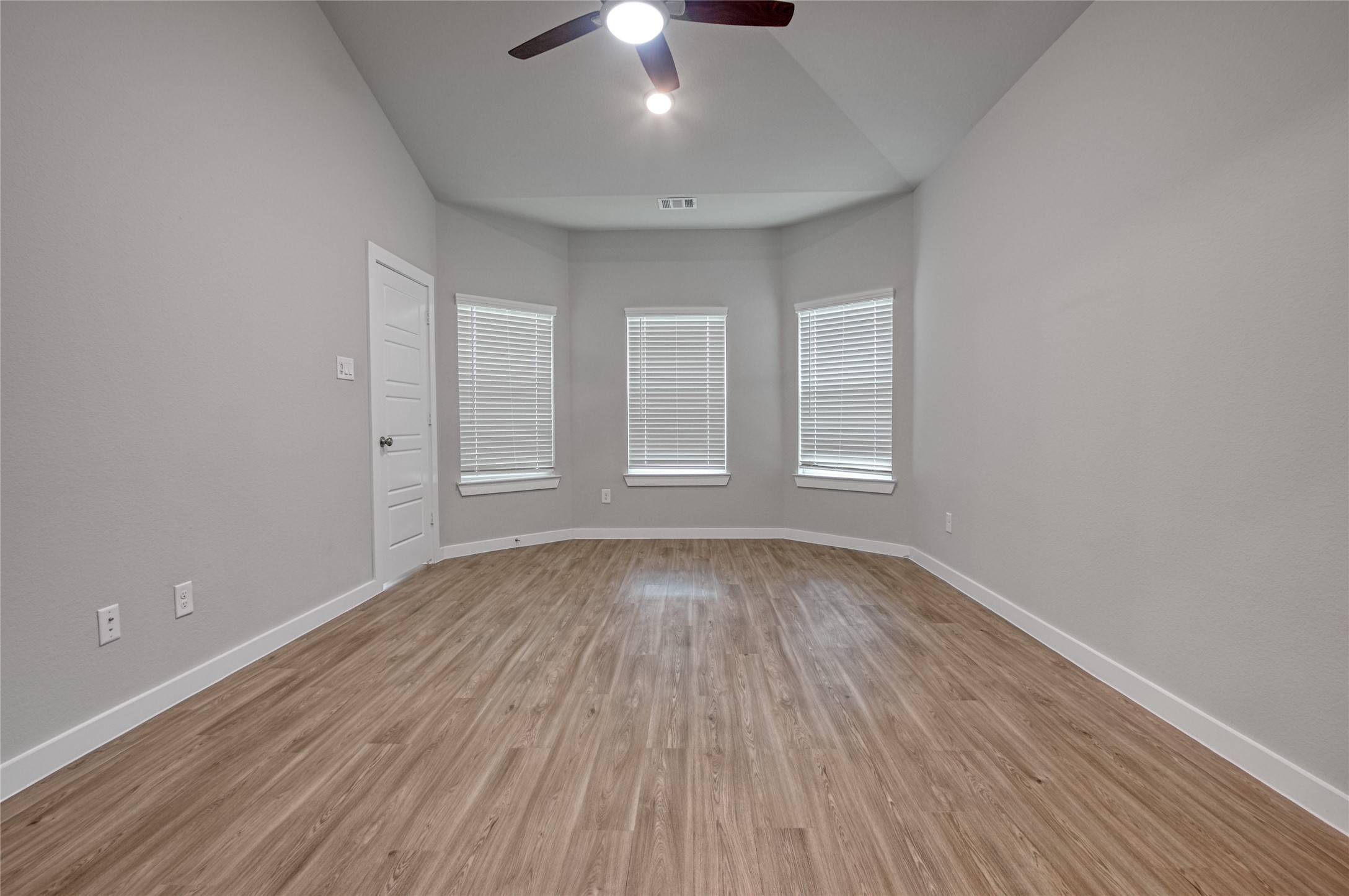 3327 Trl Vw Drive Rosenberg, TX 77471 - Photo 13 of 30 wooden floor in an empty room with a window