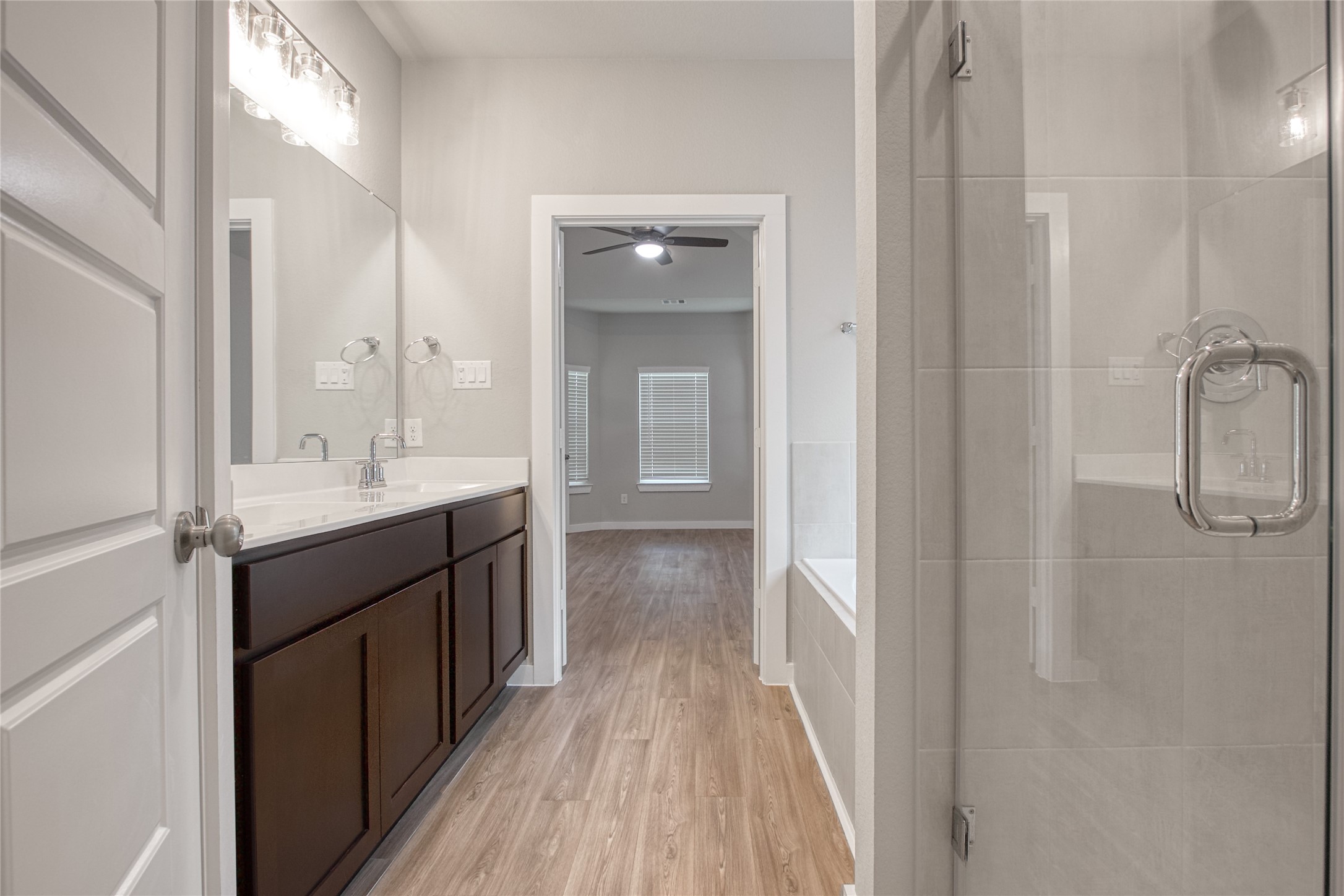 3327 Trl Vw Drive Rosenberg, TX 77471 - Photo 17 of 30 a bathroom with a double vanity sink a toilet and a mirror