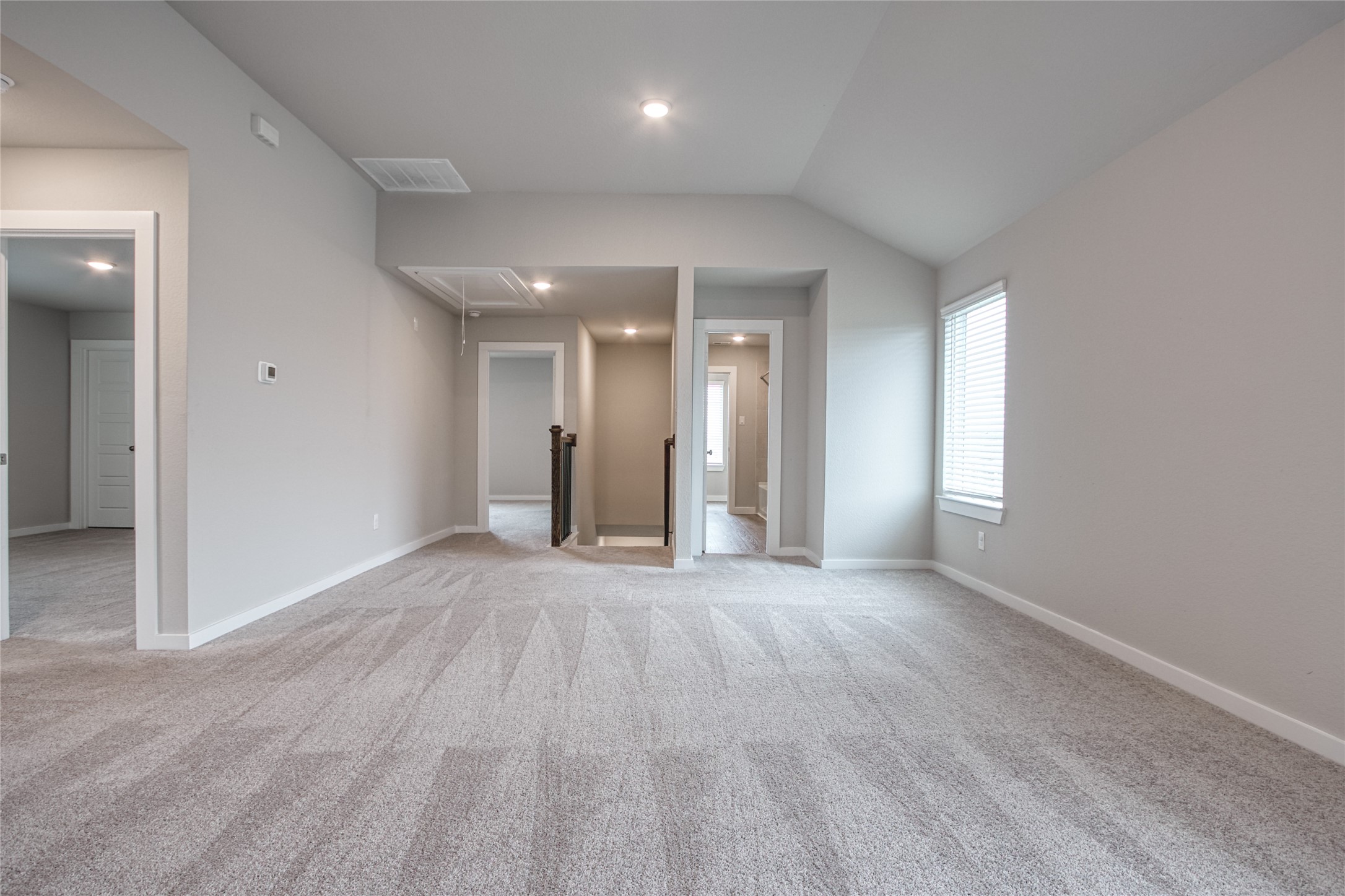 3327 Trl Vw Drive Rosenberg, TX 77471 - Photo 19 of 30 an empty room with wooden floor and windows