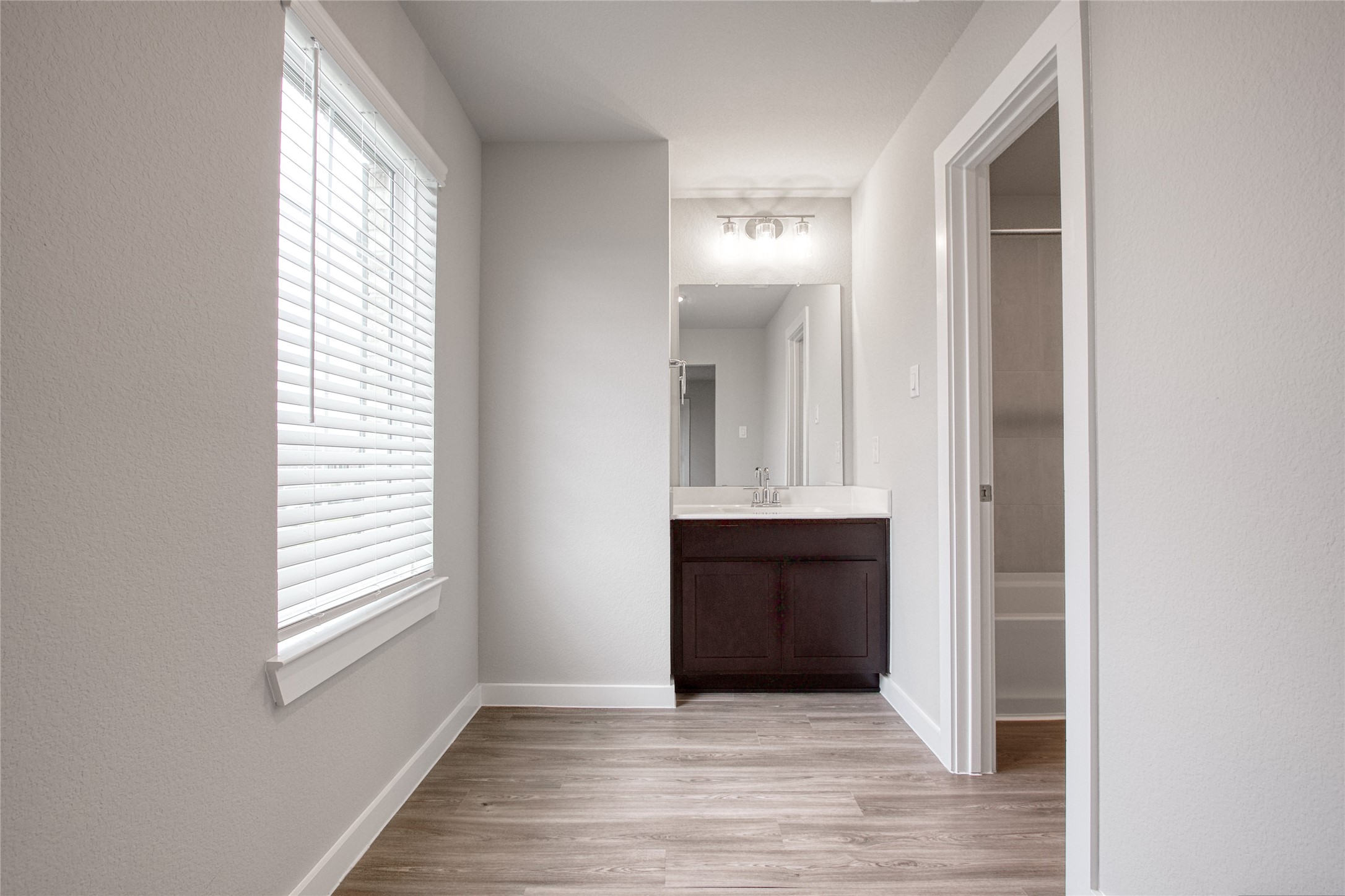 3327 Trl Vw Drive Rosenberg, TX 77471 - Photo 25 of 30 a view of an empty room with wooden floor and a window