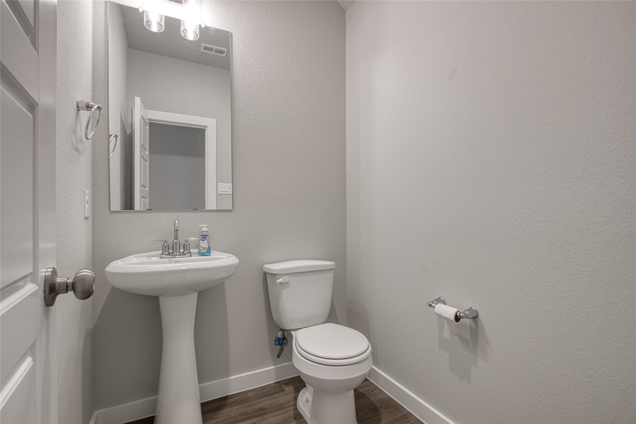 3327 Trl Vw Drive Rosenberg, TX 77471 - Photo 4 of 30 a bathroom with a toilet sink and mirror