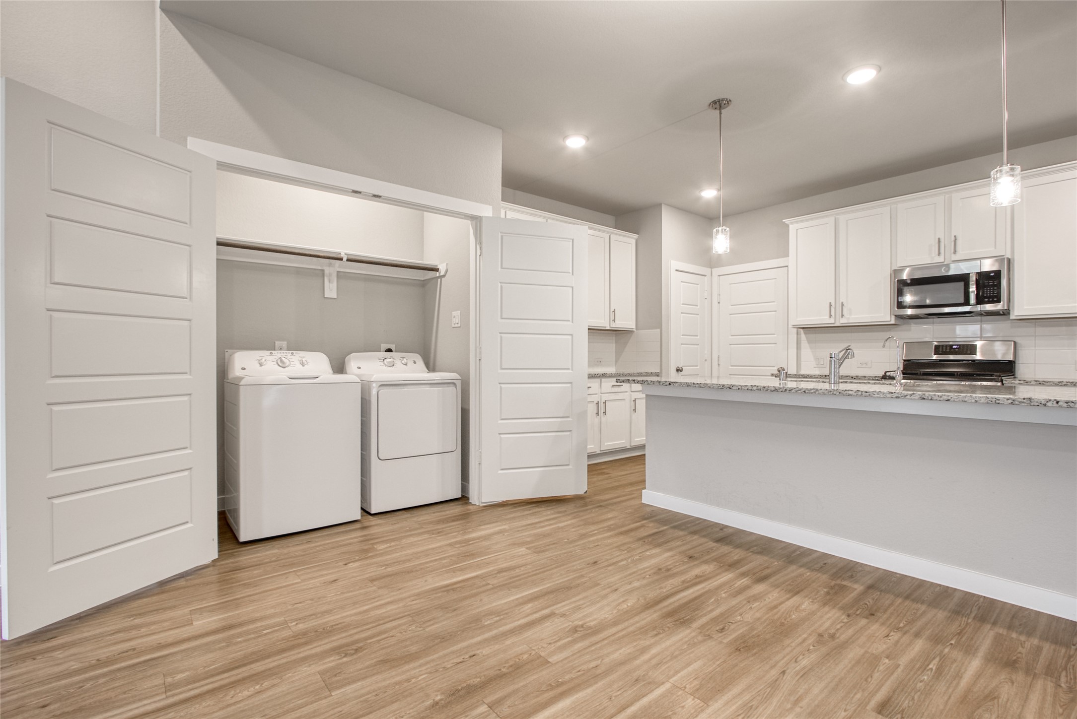 3327 Trl Vw Drive Rosenberg, TX 77471 - Photo 9 of 30 a kitchen with a sink stainless steel appliances and cabinets