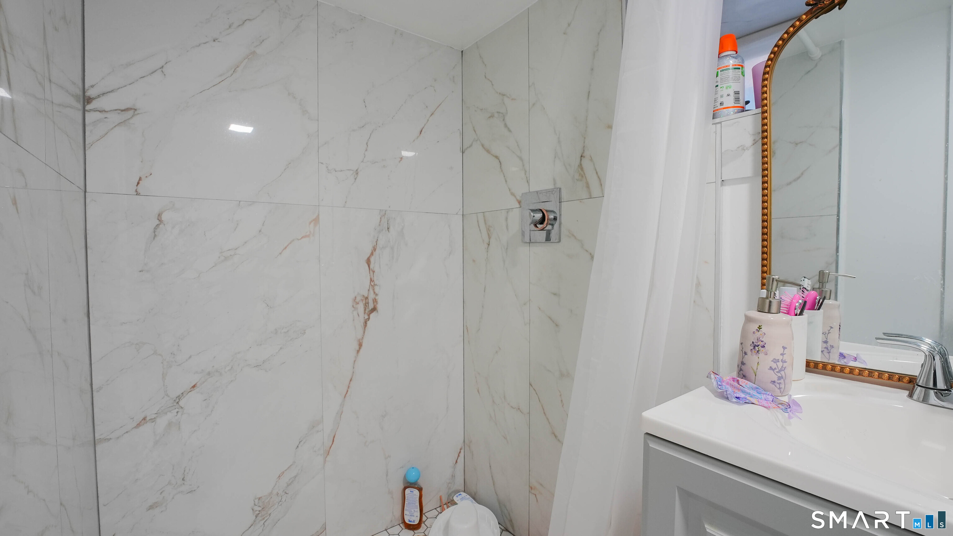 849 Frost Road Waterbury, CT 06705 - Photo 33 of 36 a bathroom with a sink vanity and toilet