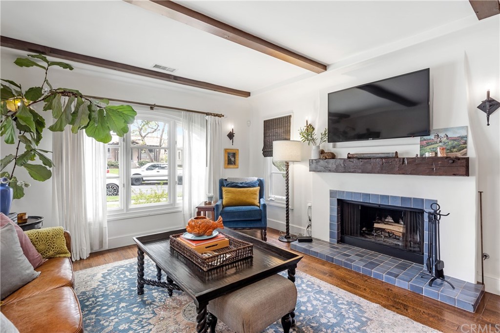 351 Whiting Street El Segundo, CA 90245 - Photo 11 of 60 a living room with furniture a flat screen tv and a fireplace