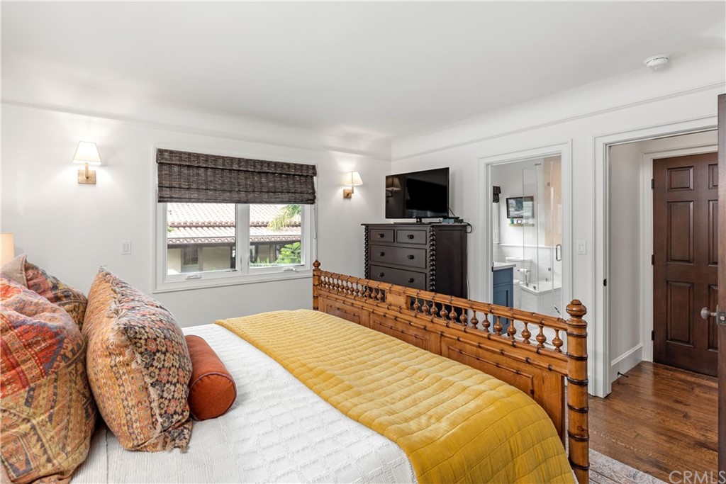 351 Whiting Street El Segundo, CA 90245 - Photo 20 of 60 a bedroom with a bed and a flat screen tv