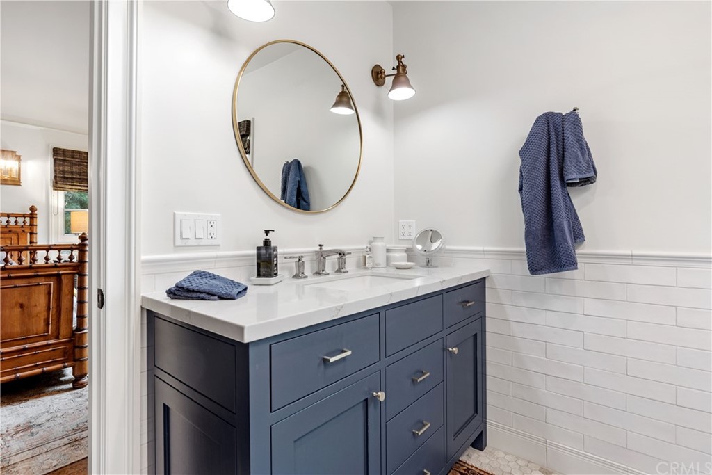 351 Whiting Street El Segundo, CA 90245 - Photo 23 of 60 a bathroom with a sink and a mirror