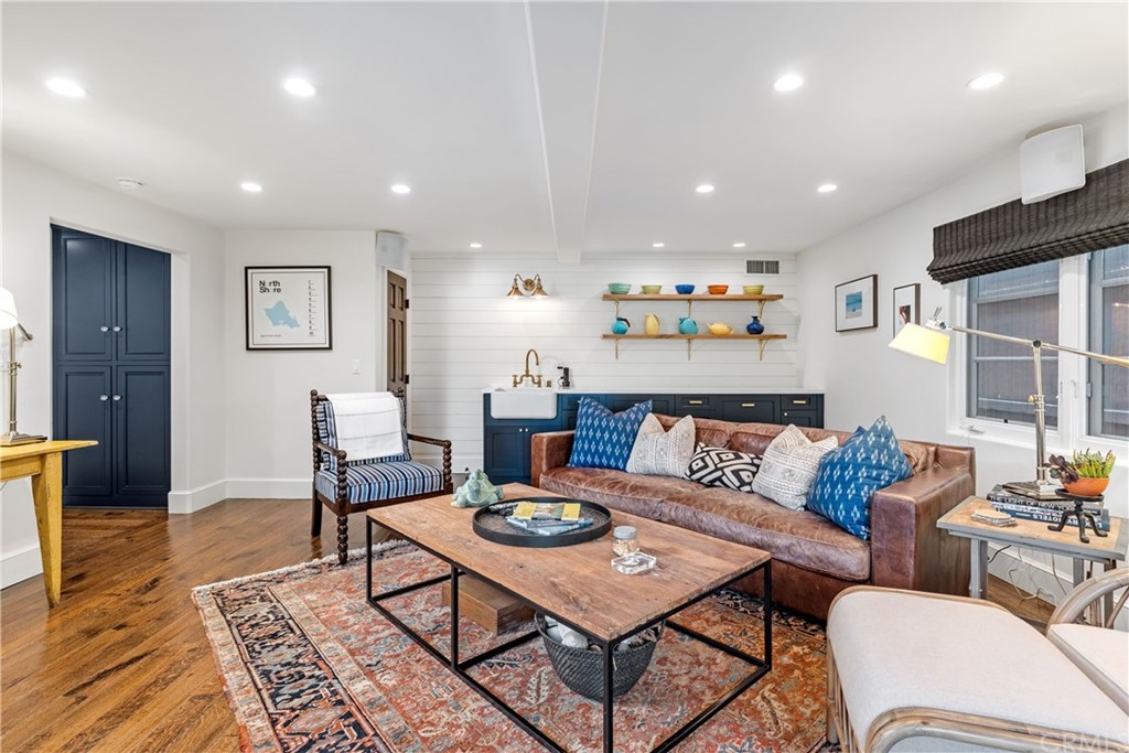 351 Whiting Street El Segundo, CA 90245 - Photo 29 of 60 a living room with furniture and a wooden floor
