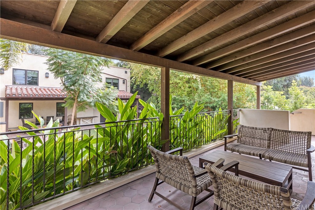 351 Whiting Street El Segundo, CA 90245 - Photo 46 of 60 a patio with glass top table and chairs