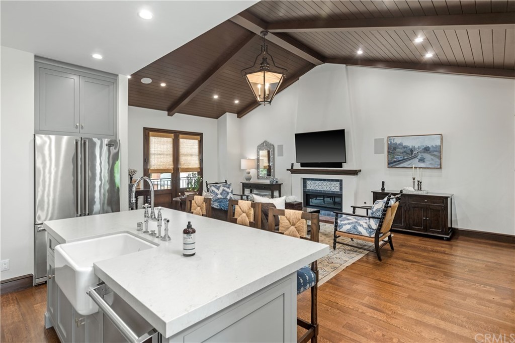 351 Whiting Street El Segundo, CA 90245 - Photo 47 of 60 a view of kitchen with stainless steel appliances wooden floor dining table and chairs