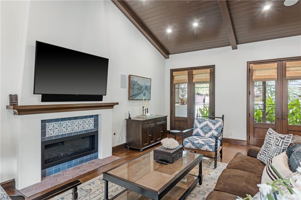 351 Whiting Street El Segundo, CA 90245 - Photo 53 of 60 a living room with furniture a flat screen tv and a fireplace