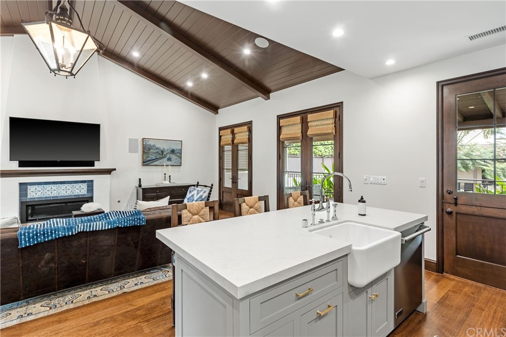 351 Whiting Street El Segundo, CA 90245 - Photo 56 of 60 a kitchen with a stove a sink and a refrigerator