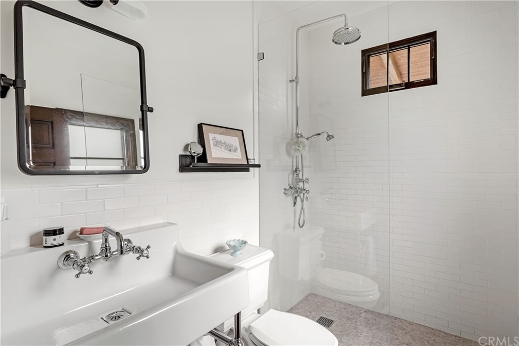 351 Whiting Street El Segundo, CA 90245 - Photo 59 of 60 a bathroom with a sink mirror and toilet