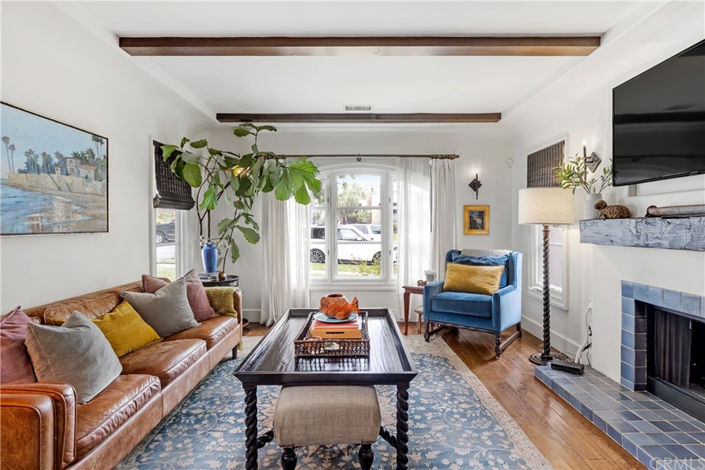 351 Whiting Street El Segundo, CA 90245 - Photo 10 of 60 a living room with furniture a flat screen tv and a fireplace