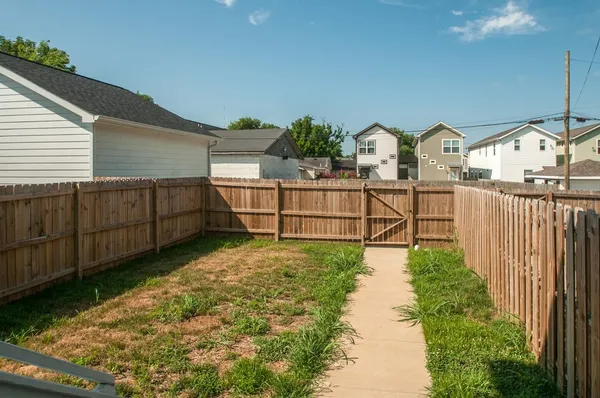a view of a backyard with sitting area