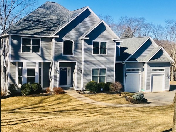 a view of a house with basketball court
