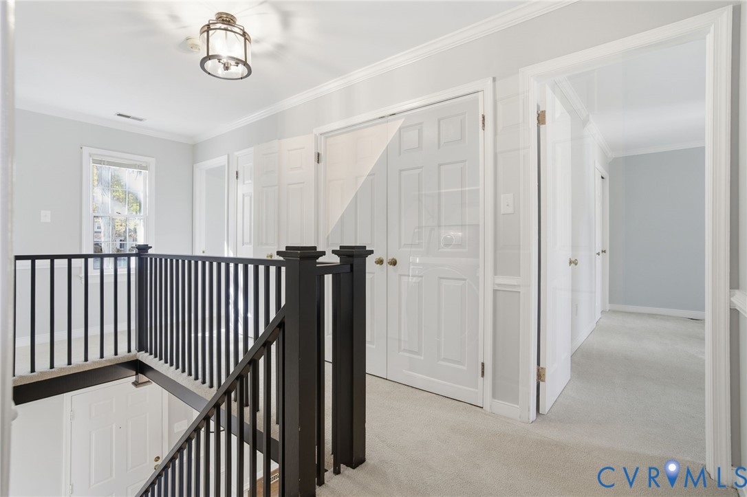 12918 Ashtree Road Midlothian, VA 23114 - Photo 16 of 43 a view of a hallway with a door and stairs