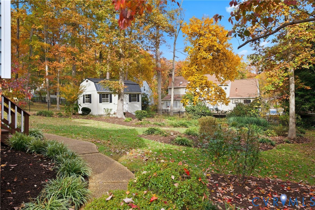 12918 Ashtree Road Midlothian, VA 23114 - Photo 33 of 43 a view of a white house with a big yard and large trees