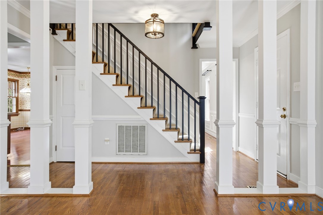 12918 Ashtree Road Midlothian, VA 23114 - Photo 5 of 43 a view of a hallway with wooden floor and staircase
