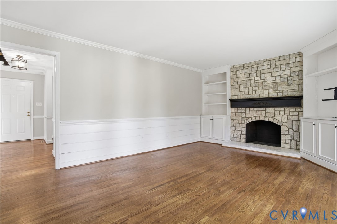 12918 Ashtree Road Midlothian, VA 23114 - Photo 7 of 43 a view of empty room with wooden floor and fireplace