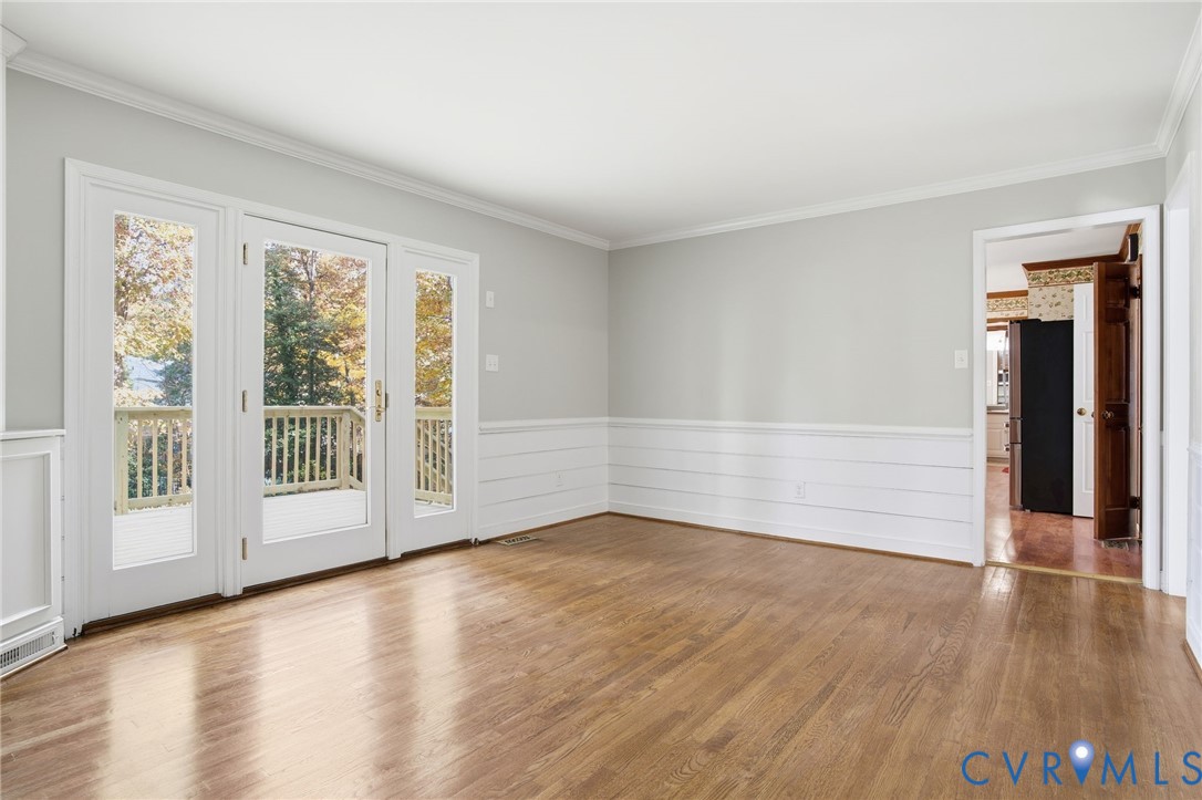 12918 Ashtree Road Midlothian, VA 23114 - Photo 9 of 43 a view of an empty room with wooden floor and a window