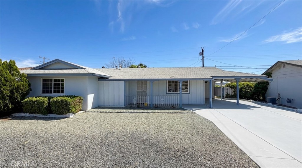 27077 El Rancho Drive Menifee, CA 92586 - Photo 2 of 11 a front view of a house with a yard and garage