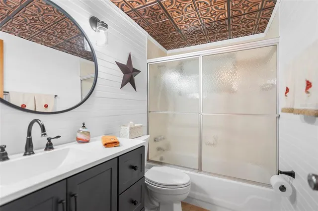 a view of a kitchen with furniture and a window