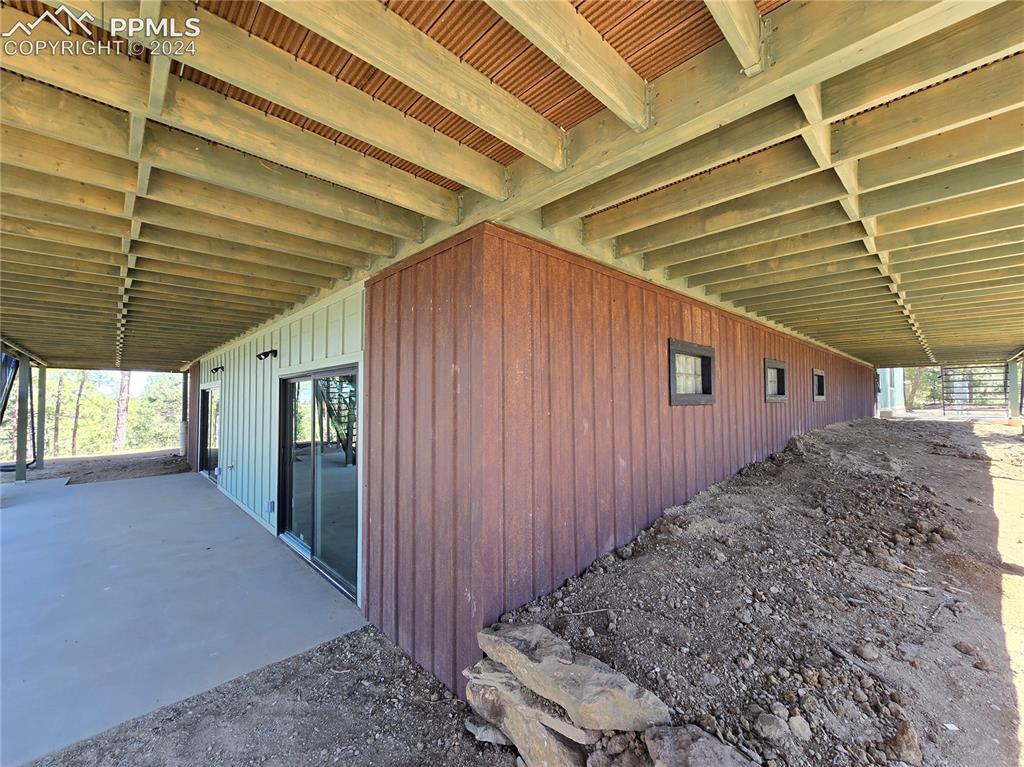 33036 Meadow Ridge Lane Trinidad, CO 81082 - Photo 12 of 50 View of lower level patiowith rusted steel siding over ICF foundation.