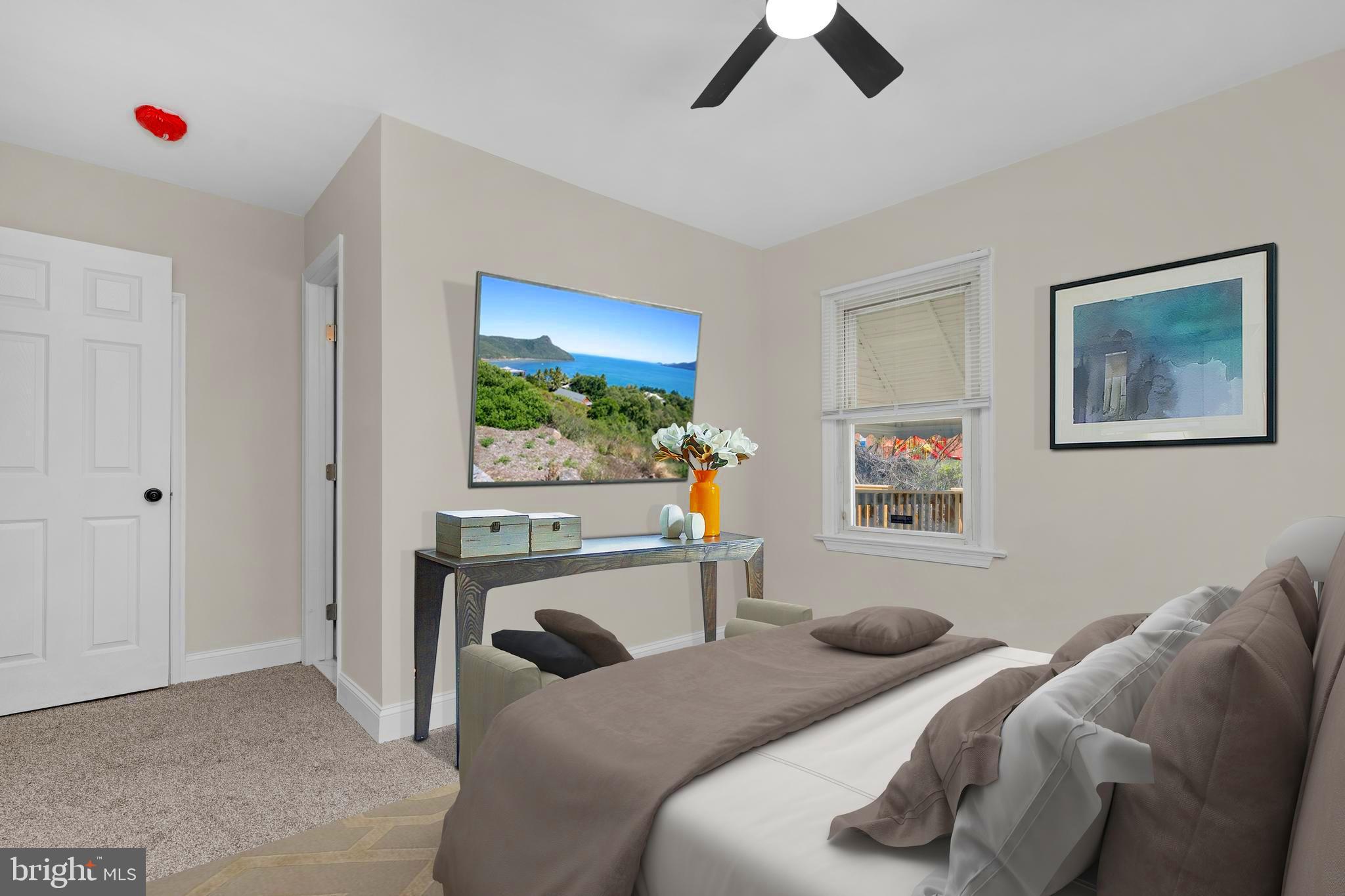 3708 West Cold Spring Lane Baltimore, MD 21215 - Photo 16 of 33 a bedroom with a bed and a chandelier