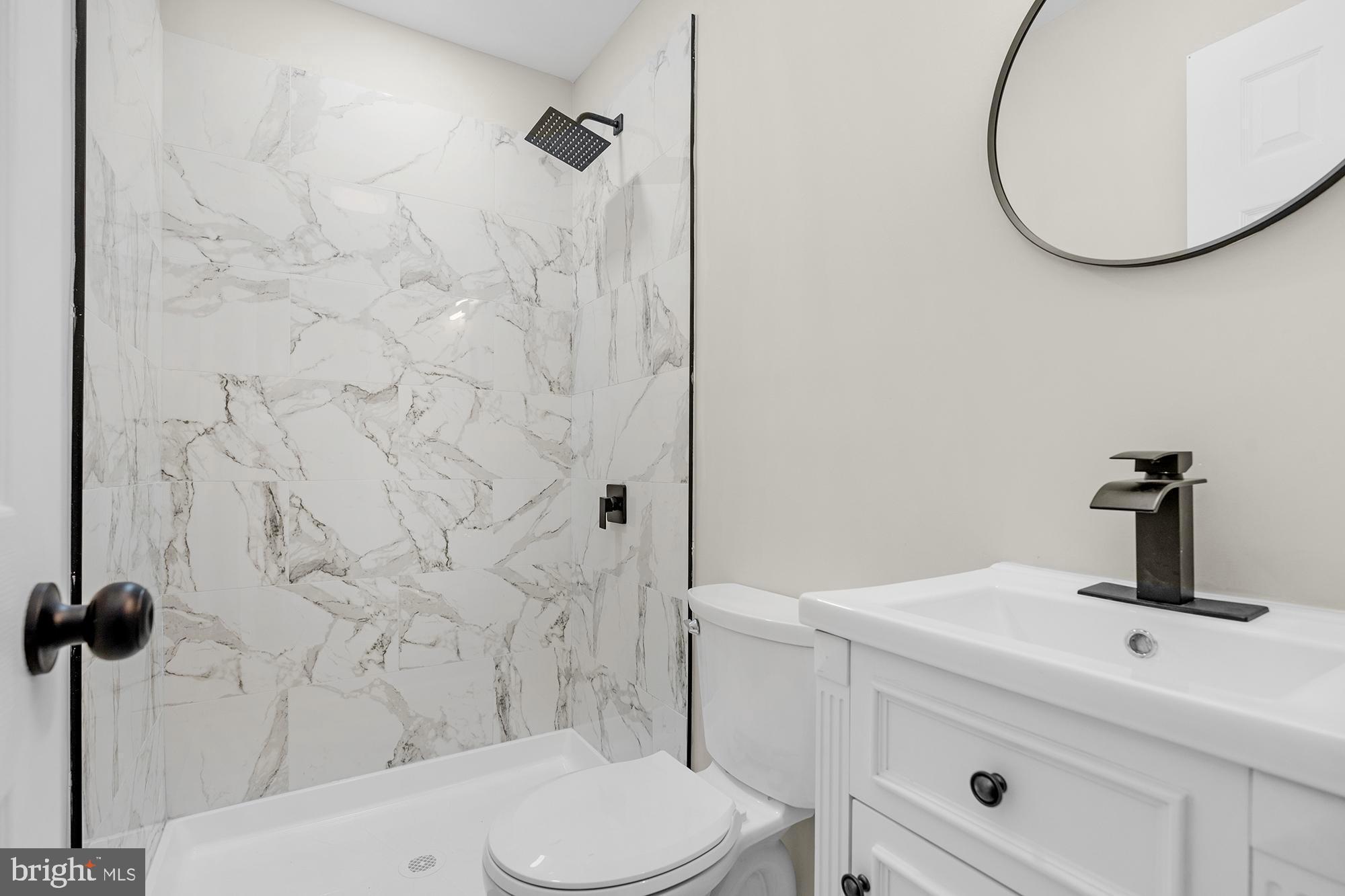 3708 West Cold Spring Lane Baltimore, MD 21215 - Photo 18 of 33 a bathroom with a sink and a mirror