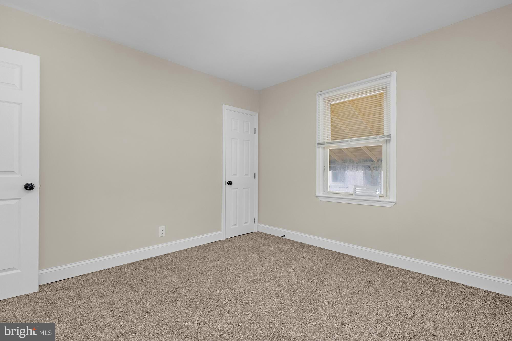 3708 West Cold Spring Lane Baltimore, MD 21215 - Photo 20 of 33 an empty room with a window