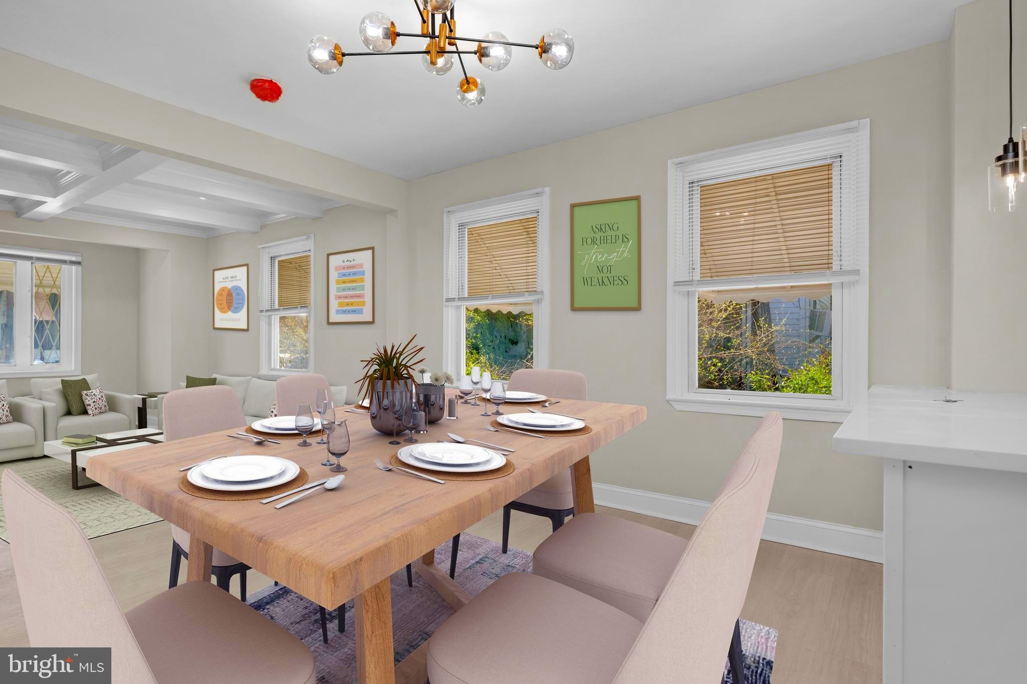 3708 West Cold Spring Lane Baltimore, MD 21215 - Photo 2 of 33 a table and chairs in a living room