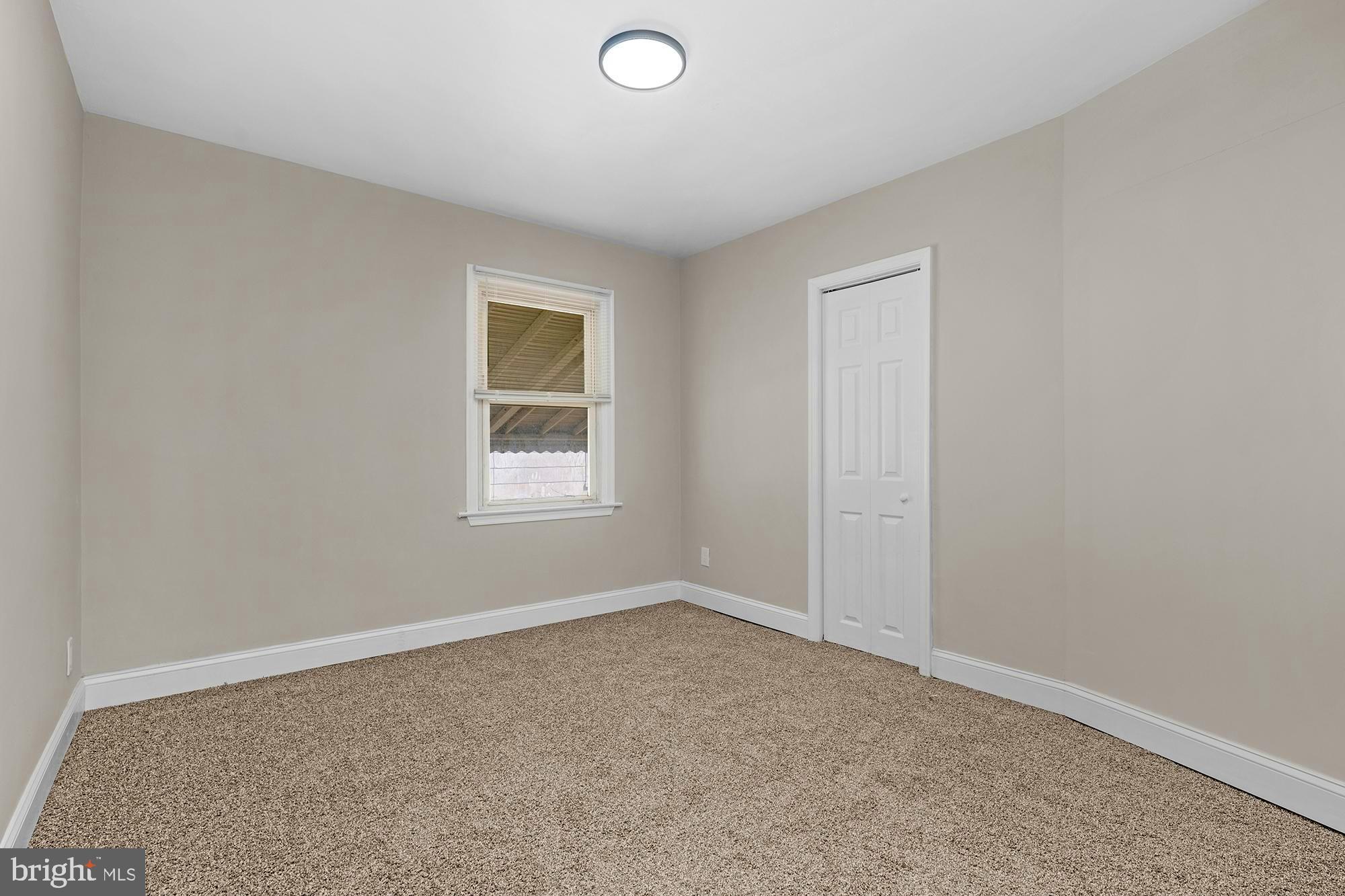 3708 West Cold Spring Lane Baltimore, MD 21215 - Photo 23 of 33 an empty room with a window