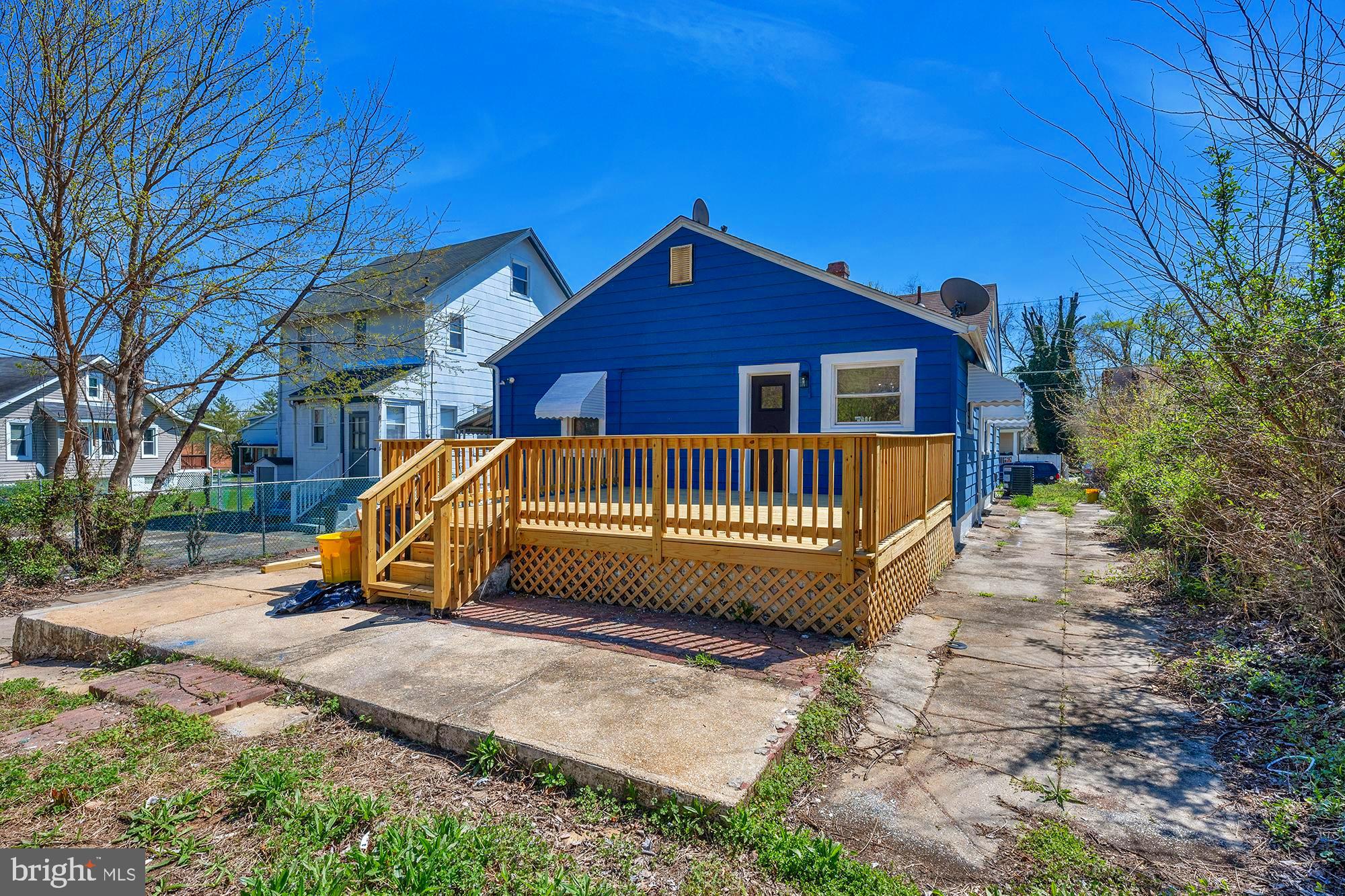 3708 West Cold Spring Lane Baltimore, MD 21215 - Photo 29 of 33 a view of a house with a yard and wooden fence