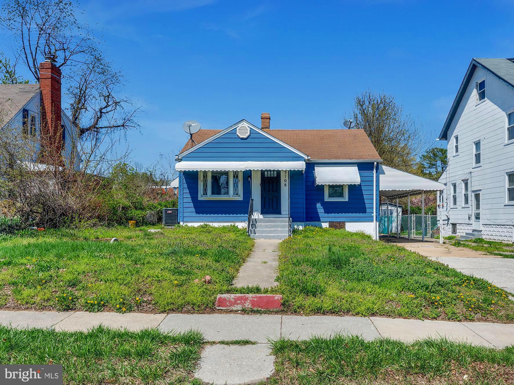 3708 West Cold Spring Lane Baltimore, MD 21215 - Photo 30 of 33 a front view of a house with a yard