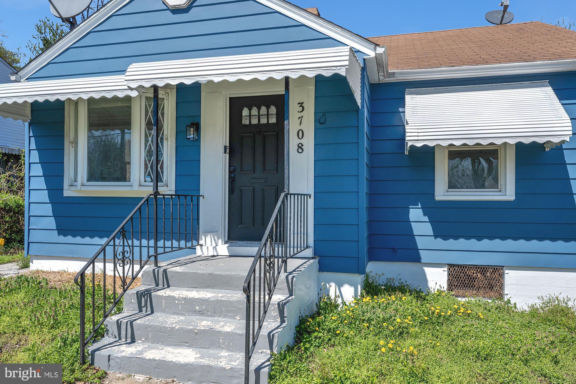 3708 West Cold Spring Lane Baltimore, MD 21215 - Photo 33 of 33 a front view of a house with a yard