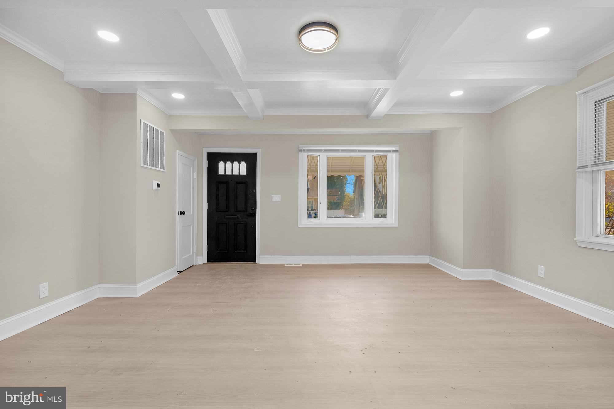 3708 West Cold Spring Lane Baltimore, MD 21215 - Photo 4 of 33 an empty room with windows and closet