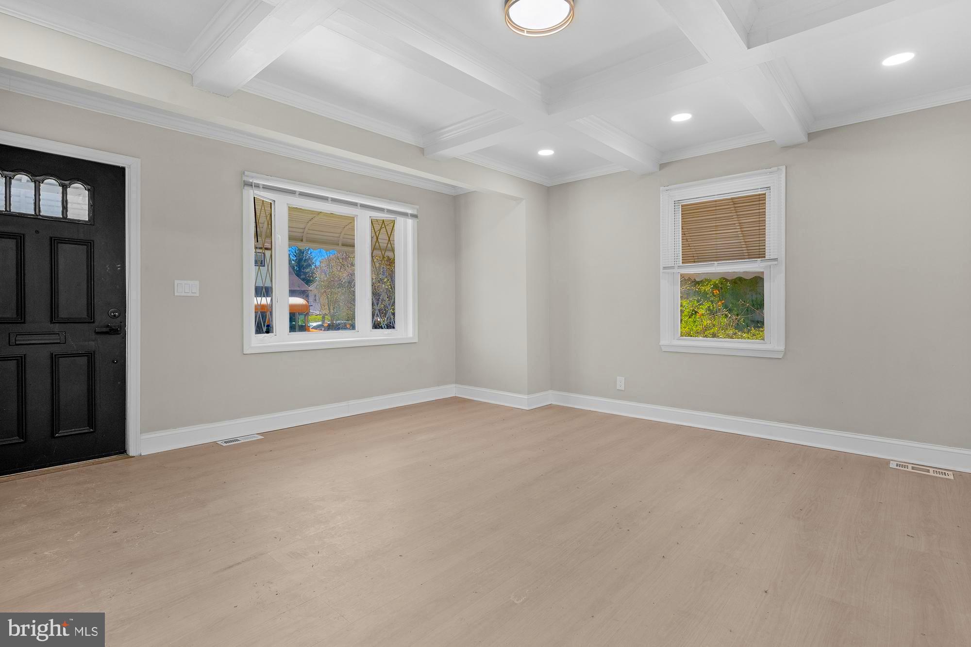 3708 West Cold Spring Lane Baltimore, MD 21215 - Photo 6 of 33 an empty room with windows and windows