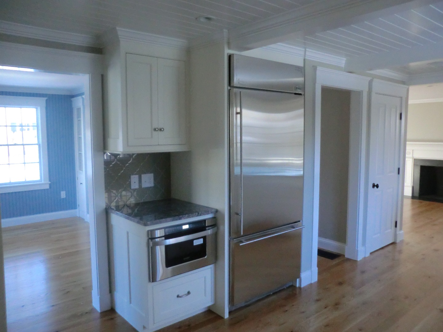 114 South Summer Street Edgartown, MA 02539 - Photo 20 of 102 a kitchen with granite countertop white cabinets and stainless steel appliances