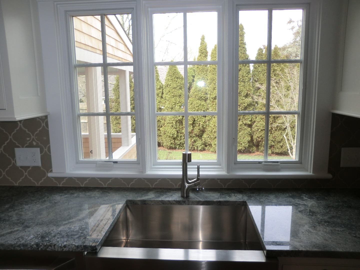114 South Summer Street Edgartown, MA 02539 - Photo 23 of 102 a view of a sink sitting in a kitchen next to a window