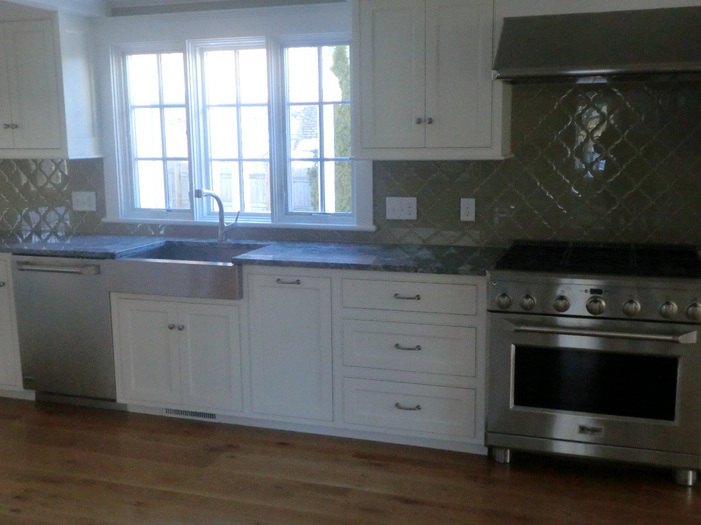 114 South Summer Street Edgartown, MA 02539 - Photo 26 of 102 a kitchen with stainless steel appliances granite countertop a stove and a sink
