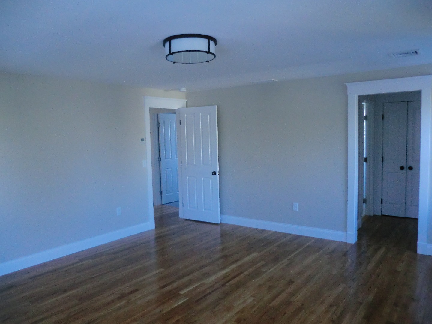 114 South Summer Street Edgartown, MA 02539 - Photo 42 of 102 a view of an empty room with wooden floor
