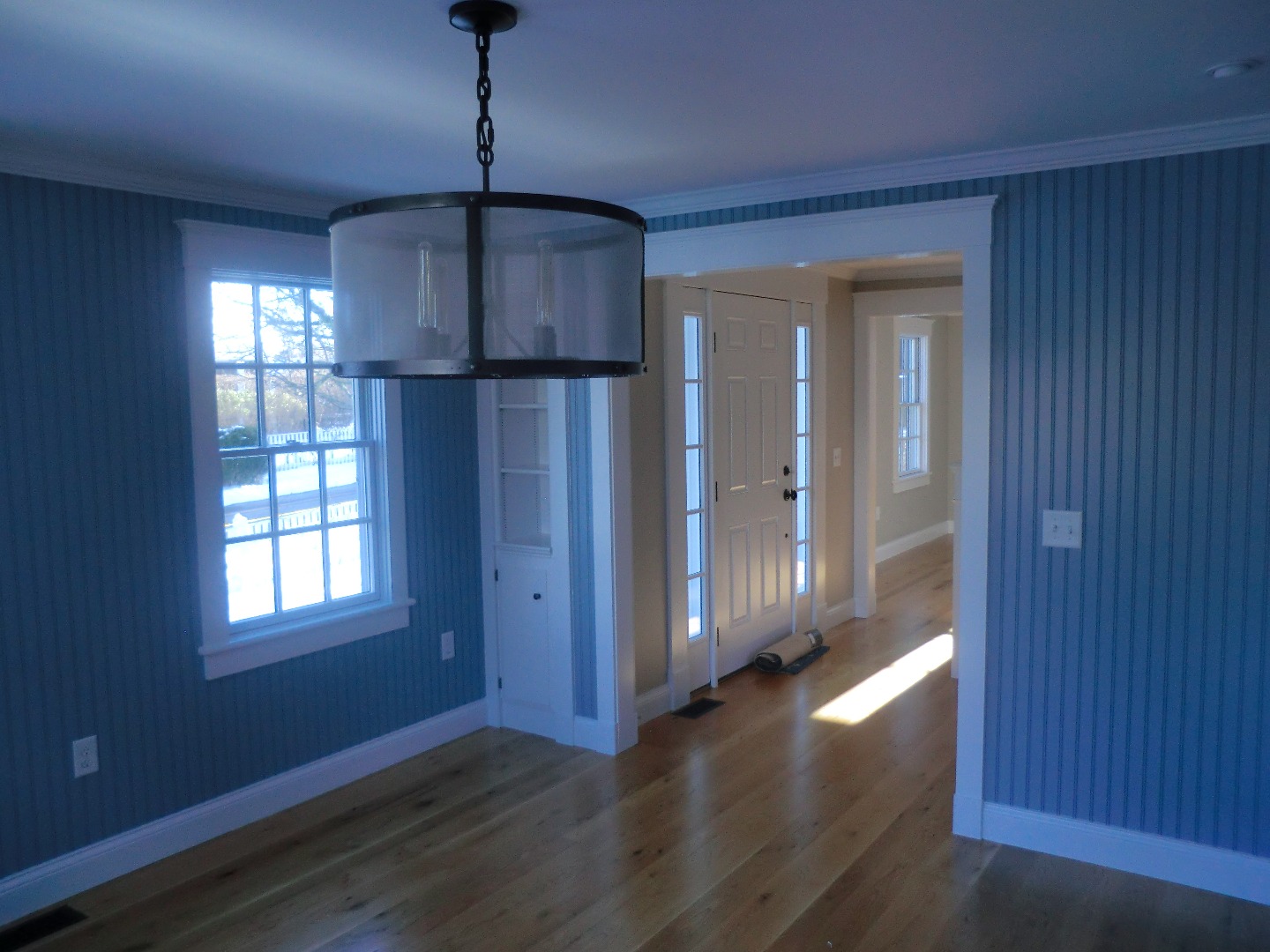 114 South Summer Street Edgartown, MA 02539 - Photo 52 of 102 a view of an empty room with wooden floor and a window