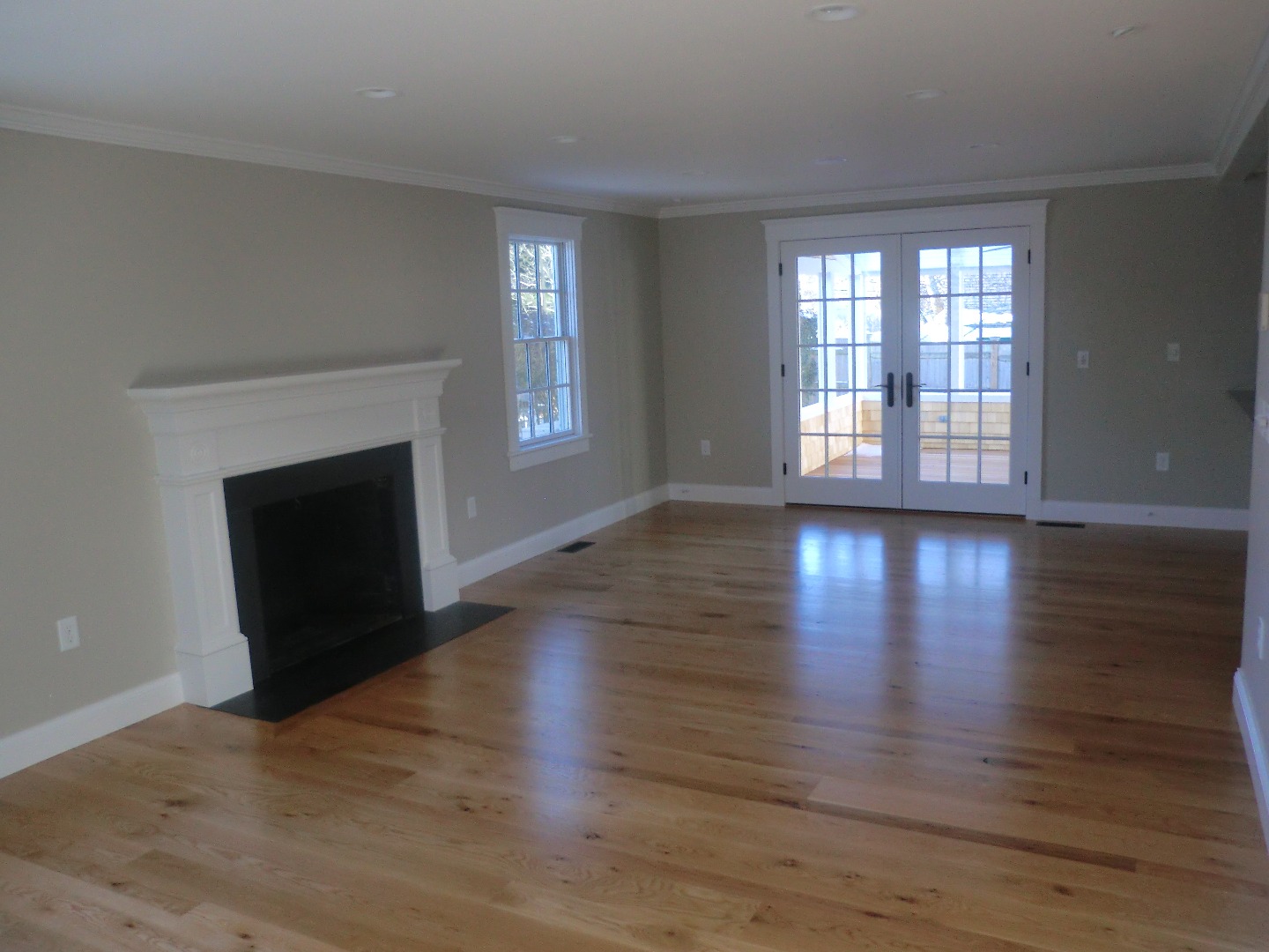 114 South Summer Street Edgartown, MA 02539 - Photo 56 of 102 a view of an empty room with wooden floor and a window