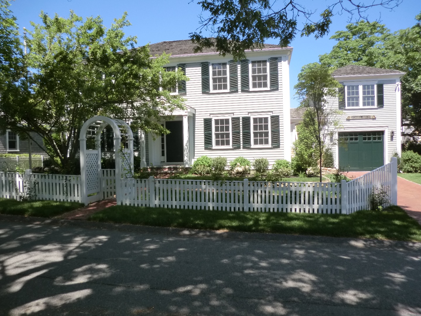 114 South Summer Street Edgartown, MA 02539 - Photo 6 of 102 a front view of a house with a garden