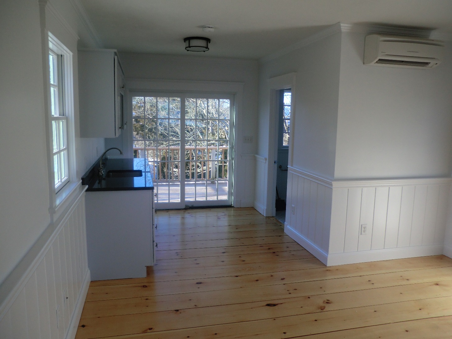 114 South Summer Street Edgartown, MA 02539 - Photo 73 of 102 a view of an empty room with wooden floor and a window