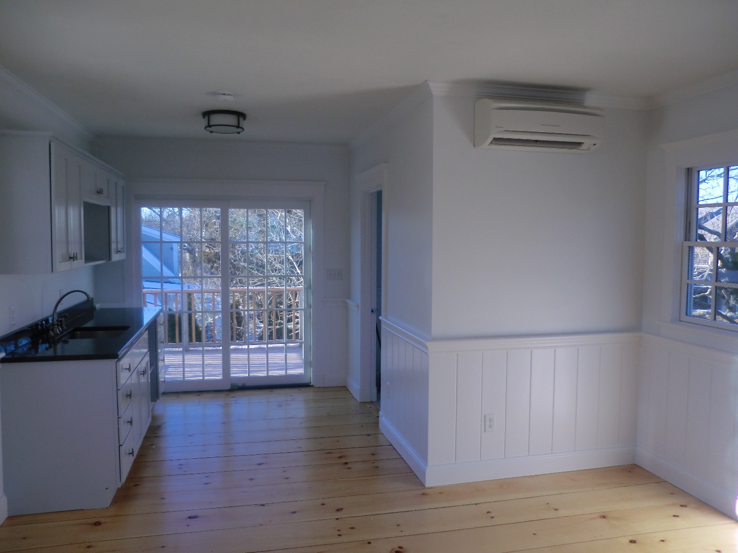 114 South Summer Street Edgartown, MA 02539 - Photo 78 of 102 a kitchen with granite countertop a stove top oven a refrigerator a sink and dishwasher with wooden floor