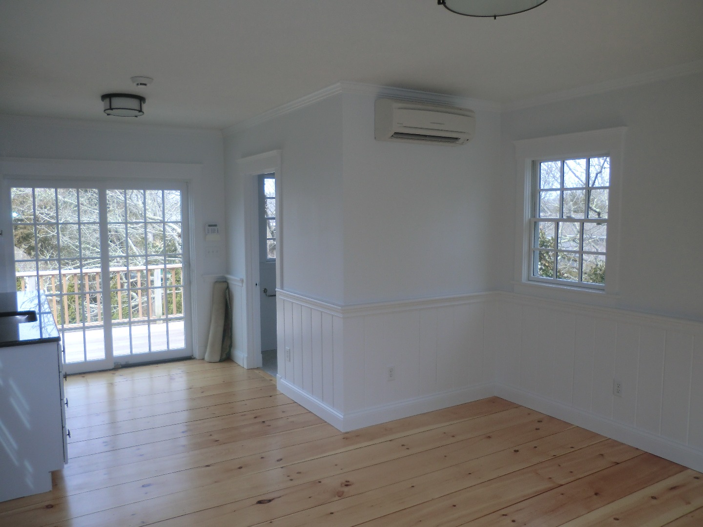 114 South Summer Street Edgartown, MA 02539 - Photo 89 of 102 an empty room with wooden floor and windows