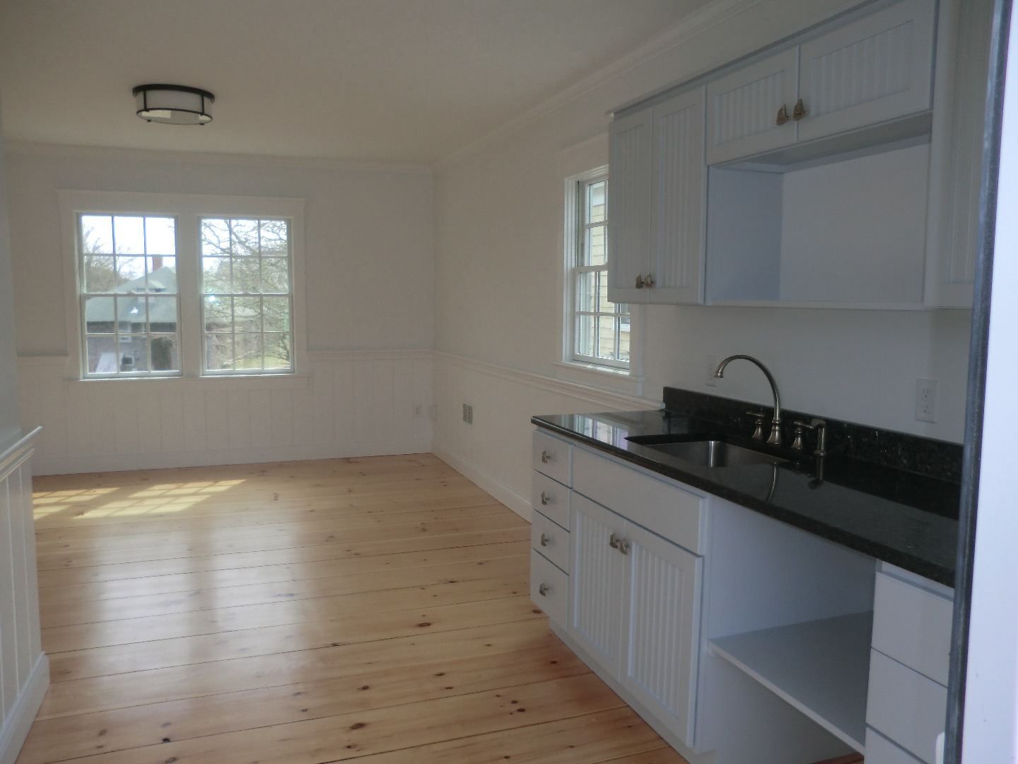 114 South Summer Street Edgartown, MA 02539 - Photo 91 of 102 a kitchen with a sink and cabinets